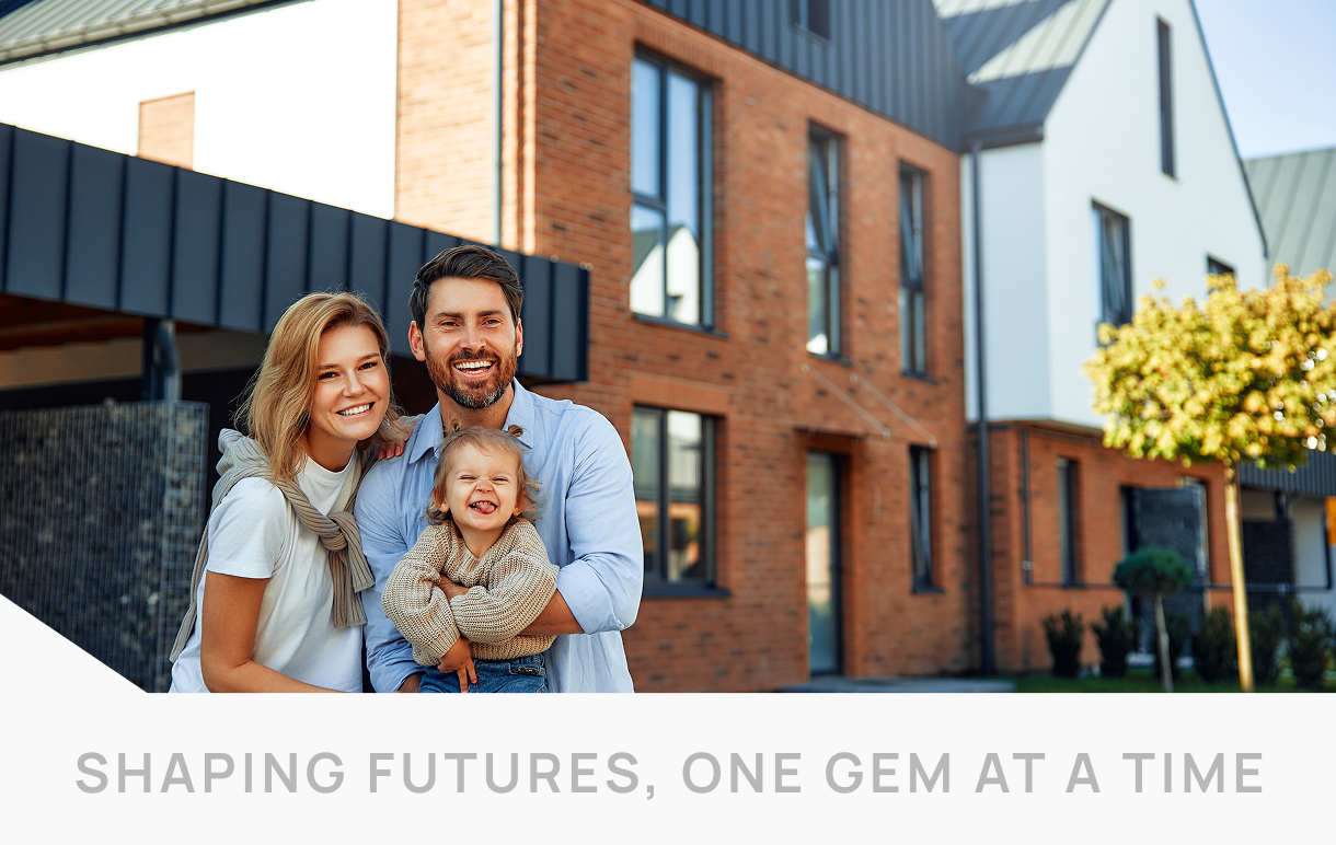 A smiling family with a toddler poses in front of a modern brick house. The text reads, "Shaping futures, one gem at a time," with guidance from real estate experts.